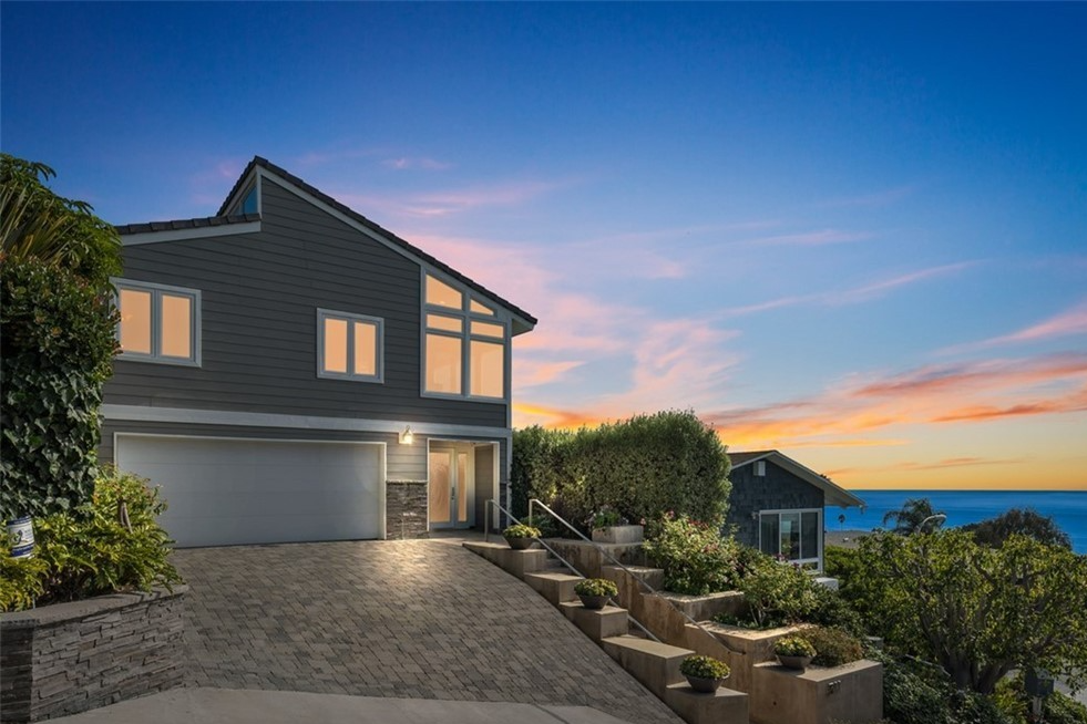 house on hill overlooking ocean